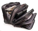 An open black 13"-17.3” Professional Rolling Laptop briefcase made from ballistic nylon. Includes 5-stage telescoping handle, a padded top carry, in-line skate wheels, trolley strap for stacking on other luggage. Also has adjustable, padded laptop compartment, separate fleece lined pouch for an iPad, tablet or e-reader, a large file section, oversized compartment & zippered front organizer section.